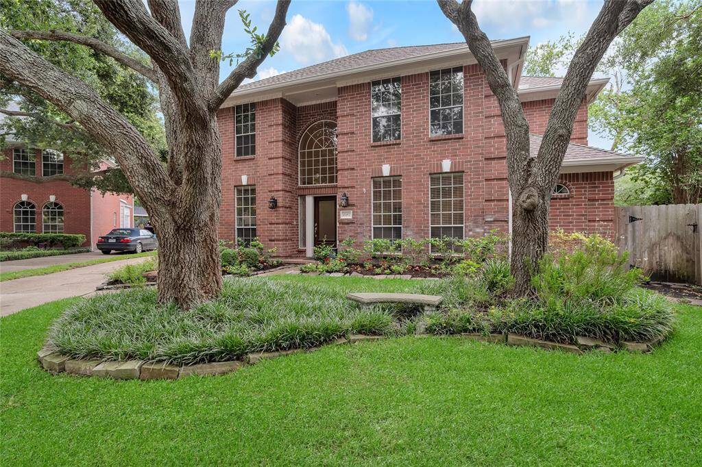 The property is located on an oversized lot with a swimming pool and has a 2-car garage.