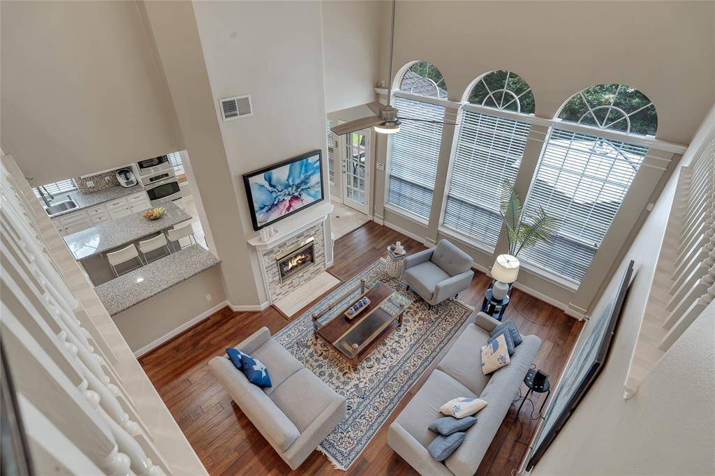 A view down into the living room. The interior walls and trim of this property will be painted before a new tenant moves in.