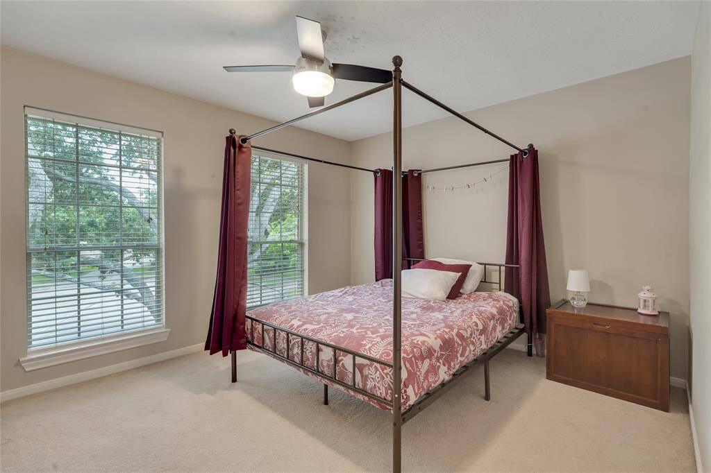 Bedroom 3 is located on the second floor. With a modern ceiling fan and a walk-in closet.