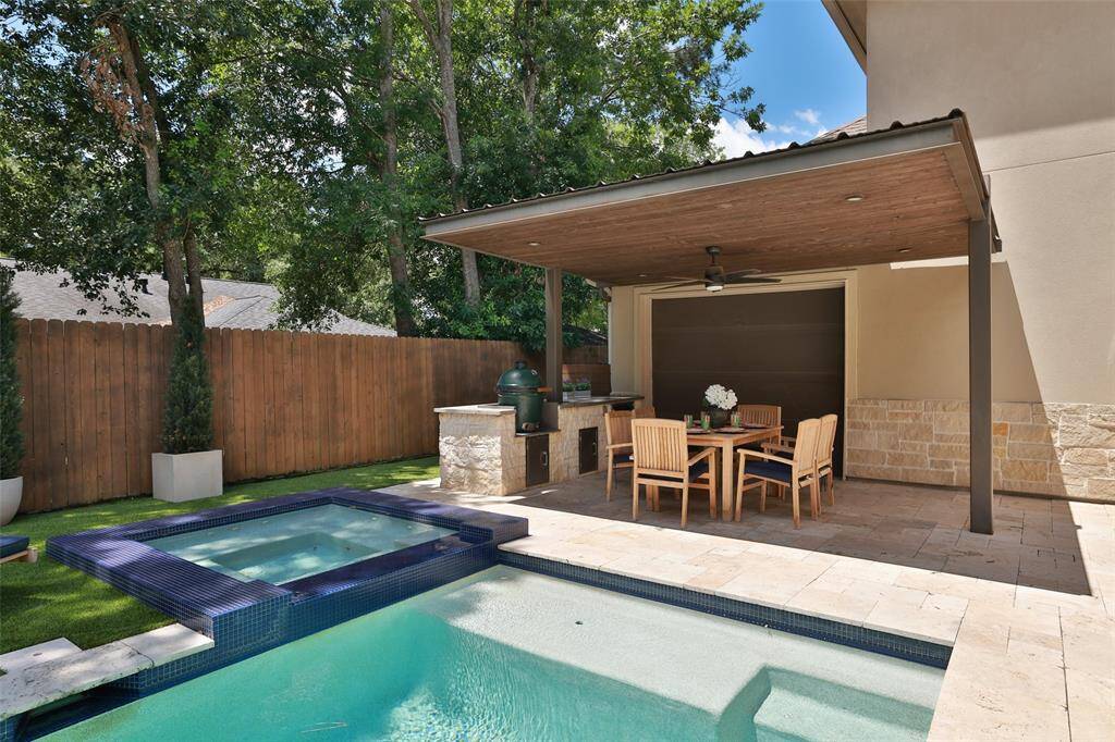 Door at back of the patio has a power lift and opens to the third car garage to add extended space for parties.