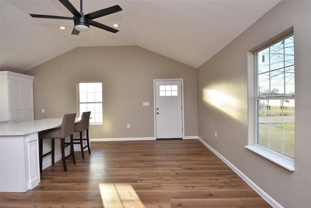 The entrance of the home leads to the kitchen which has a large granite countertop island!