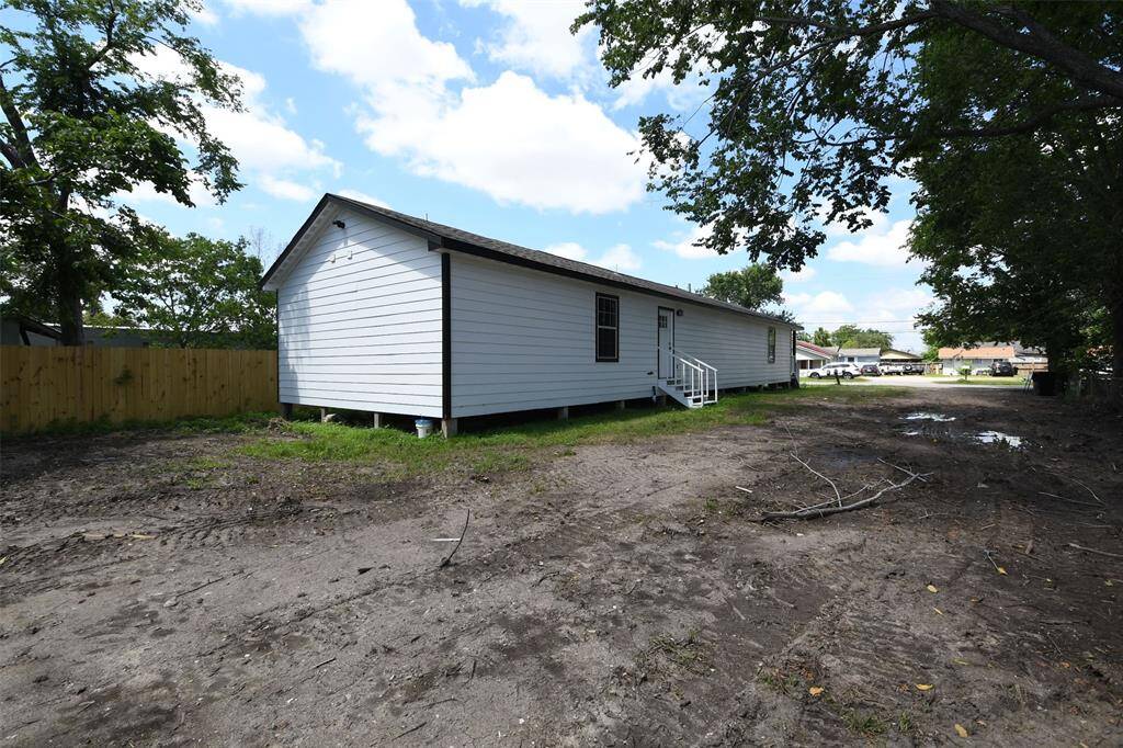 Plenty of side yard and partially fenced.