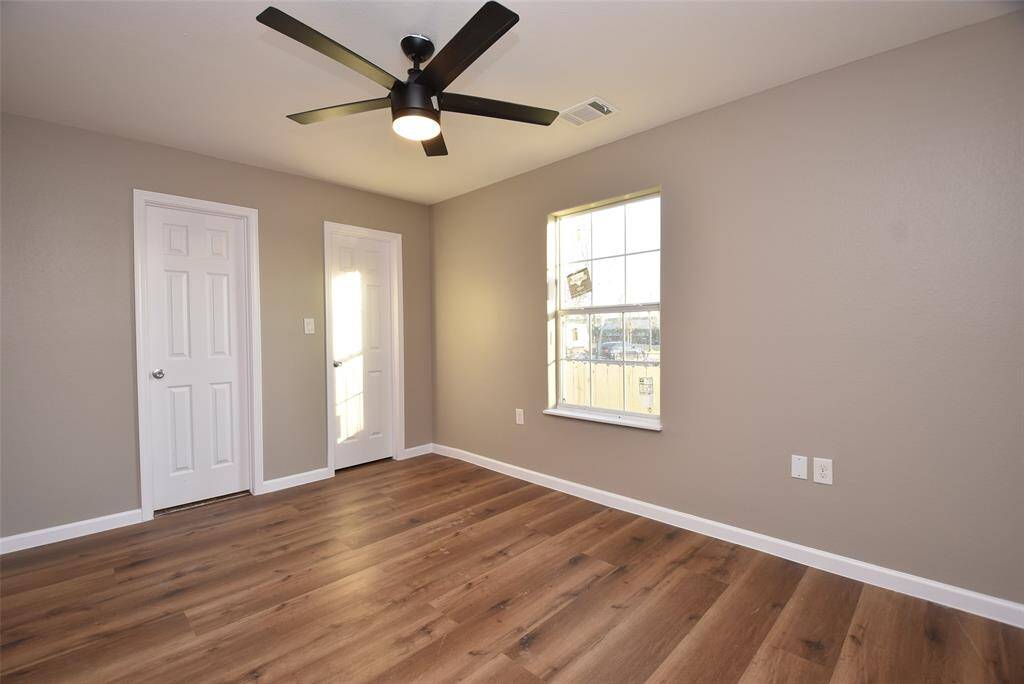 Bedroom #3 includes a ceiling fan and has freshly painted neutral walls.