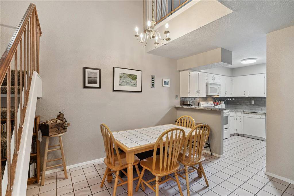 This is your dining area with plenty of room for whatever table you choose.