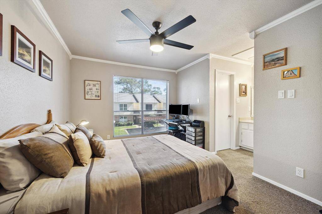 The secondary bedroom has an ensuite bathroom with the vanity open to the bedroom. This room,also, boasts a nice size closet.