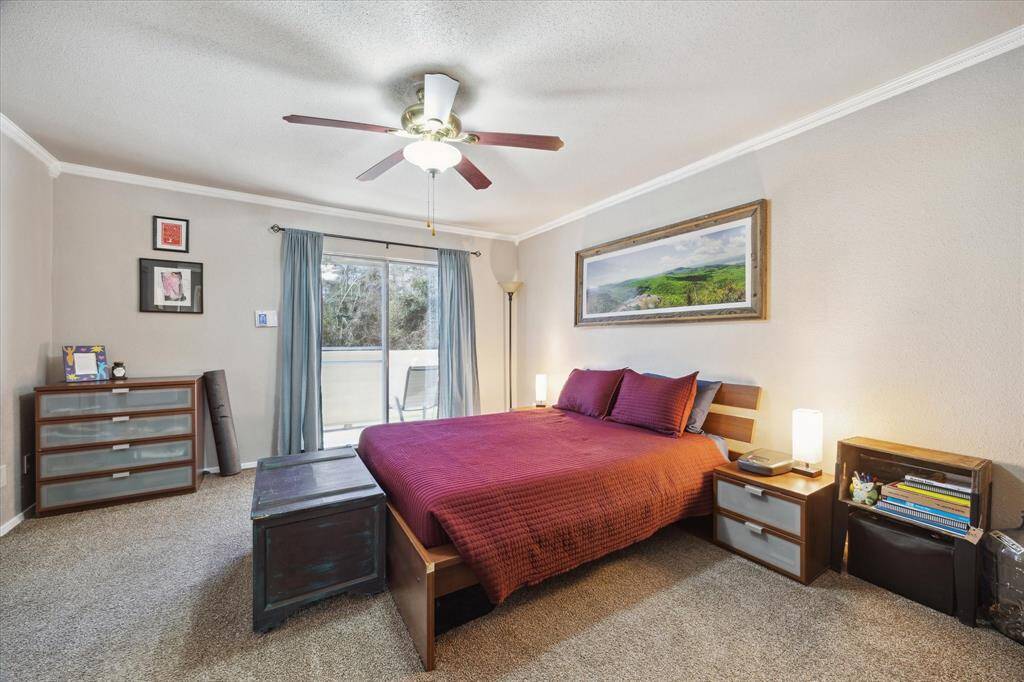 Your primary bedroom is very spacious. It has a large sliding glass door that opens up to a wonderful second floor balcony. This balcony faces out to the back of your property overlooking your patio and a beautiful green space . There are no neighbors behind and a wooded area beyond your yard. This is a protective area that will never be built on.
