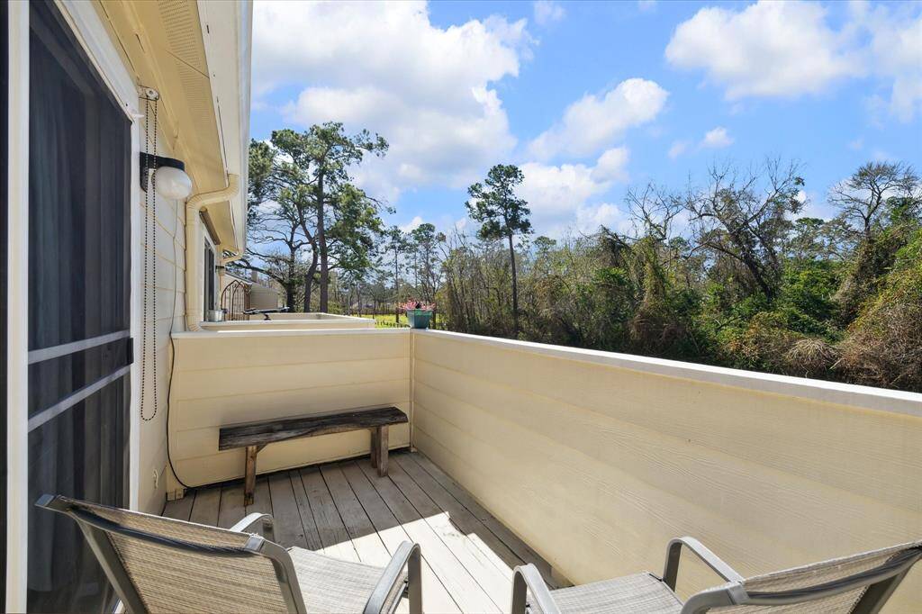 This home boasts a large, second floor patio off of the primary bedroom. There is a glass sliding door with a sliding screen for days you would like to enjoy some fresh air. This patio faces out toward the back of your home over a beautiful green space and wooded area.