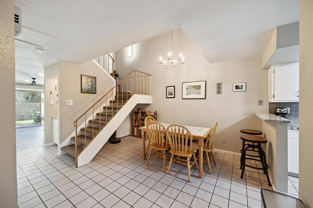 As you enter the home, you see an open inviting dining and kitchen area And the living room with the wonderful woodburning fireplace straight ahead.