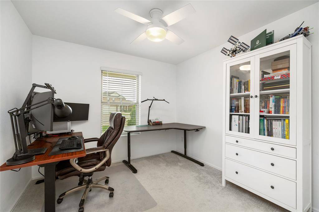 Versatile bedroom at the front of the house is perfect for your home office, study nook or creative space. Features great closet space and upgraded ceiling fan.