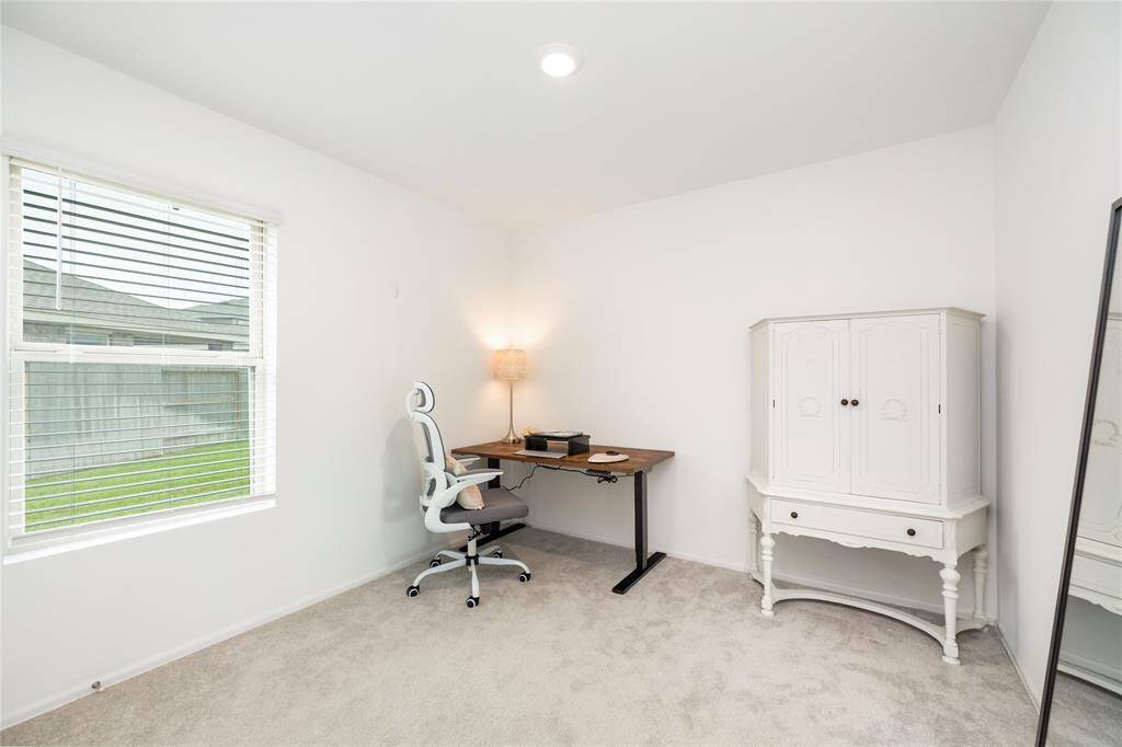 Here is the third bedroom just down the hall. It has a great closet for storage and private views of the expansive side yard.