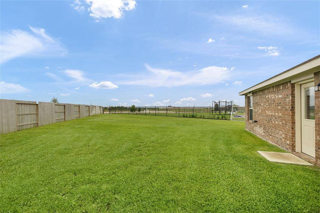 Wide open backyard view and endless possibilities for customization.
