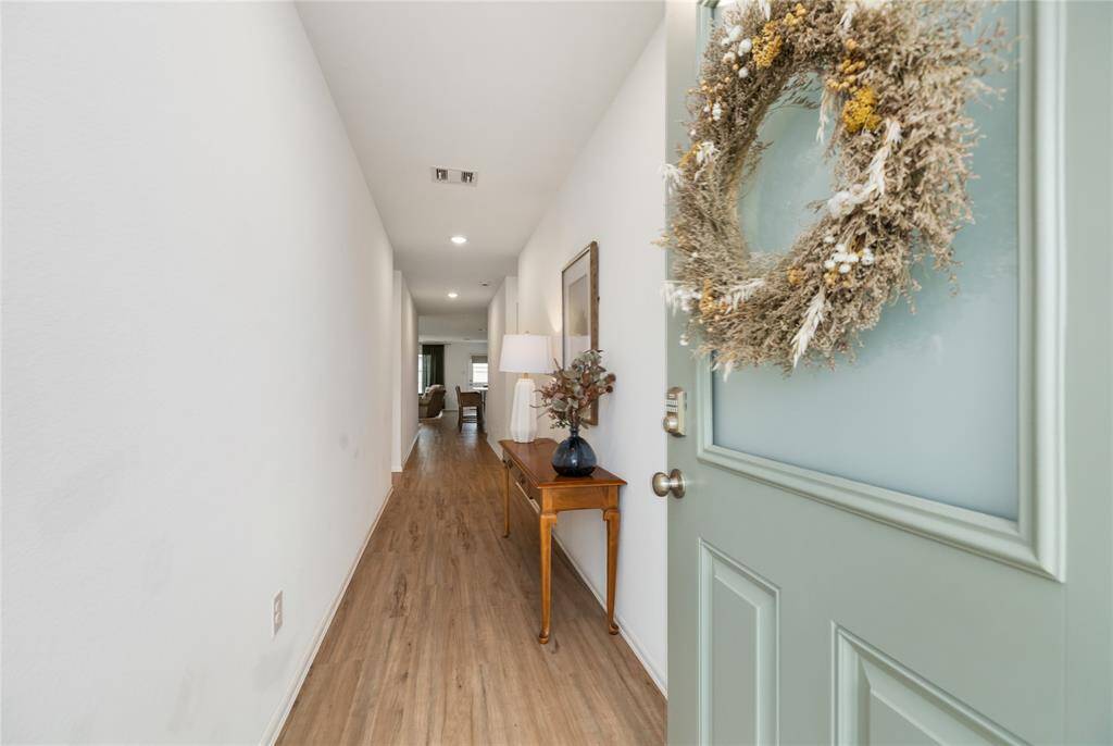 A view inside the front door with a welcoming entry way and natural light.