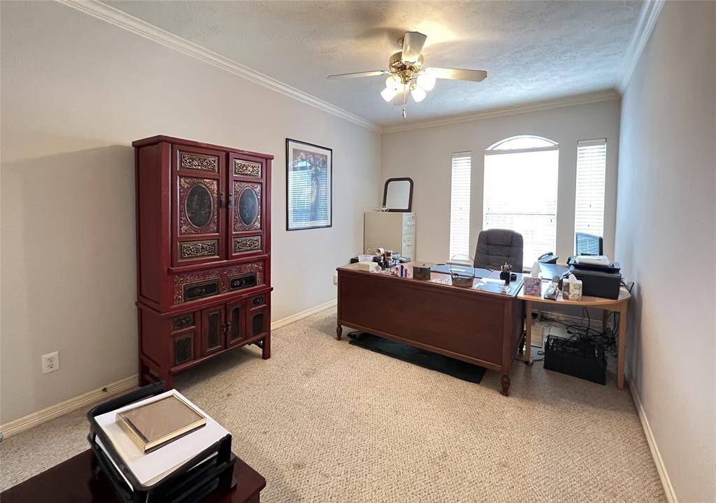 Bedroom 3 on the second floor (furnished as office).