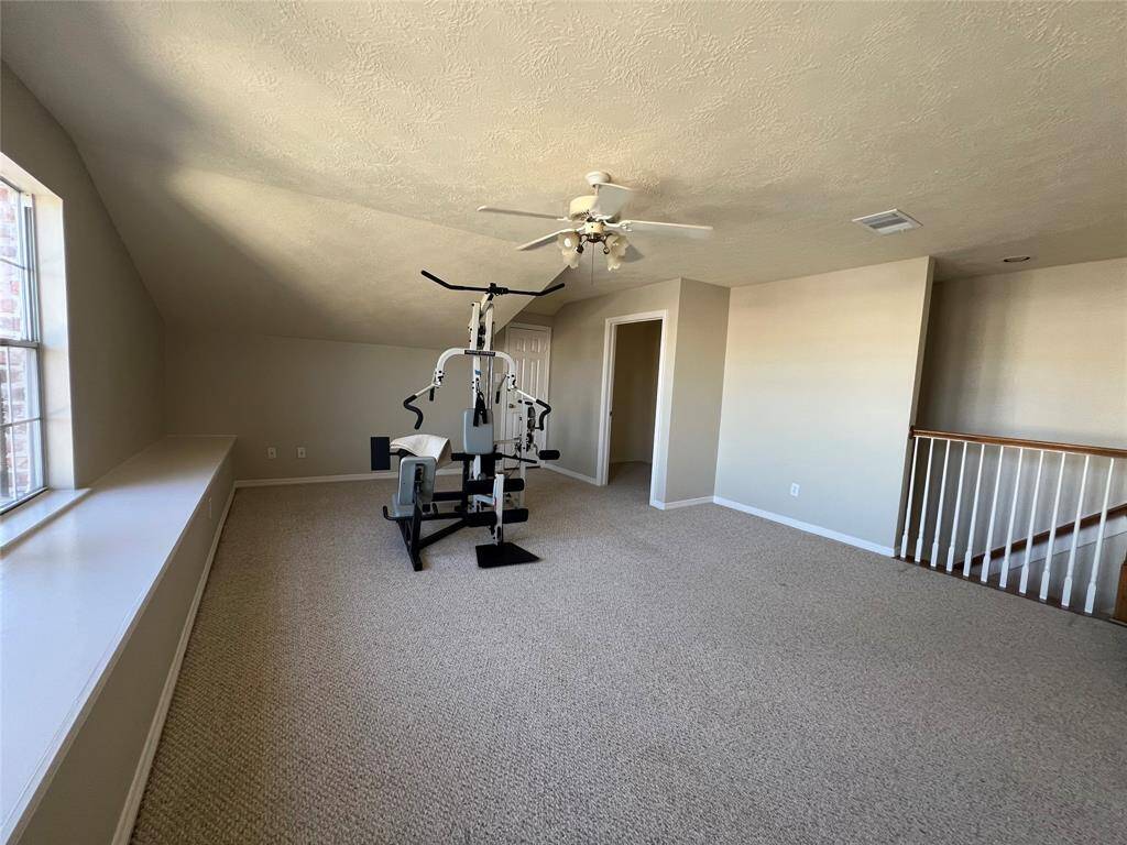 Third floor flex space.  Great for home gym, media room, home office, or 4th bedroom.