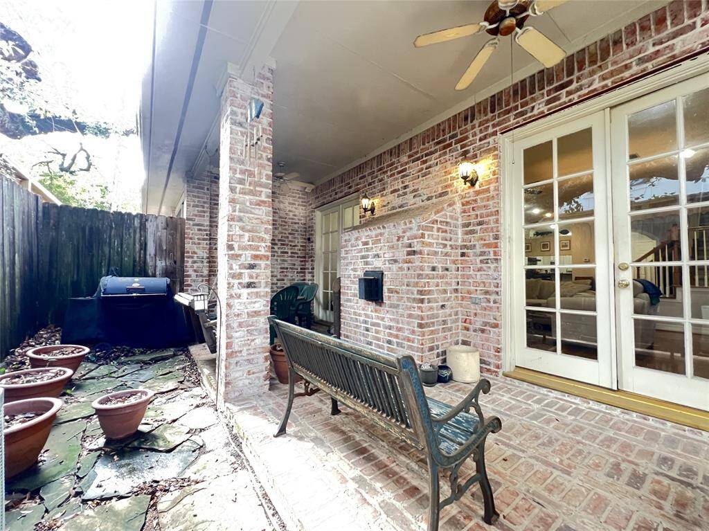 Cozy backyard with covered patio for entertaining.