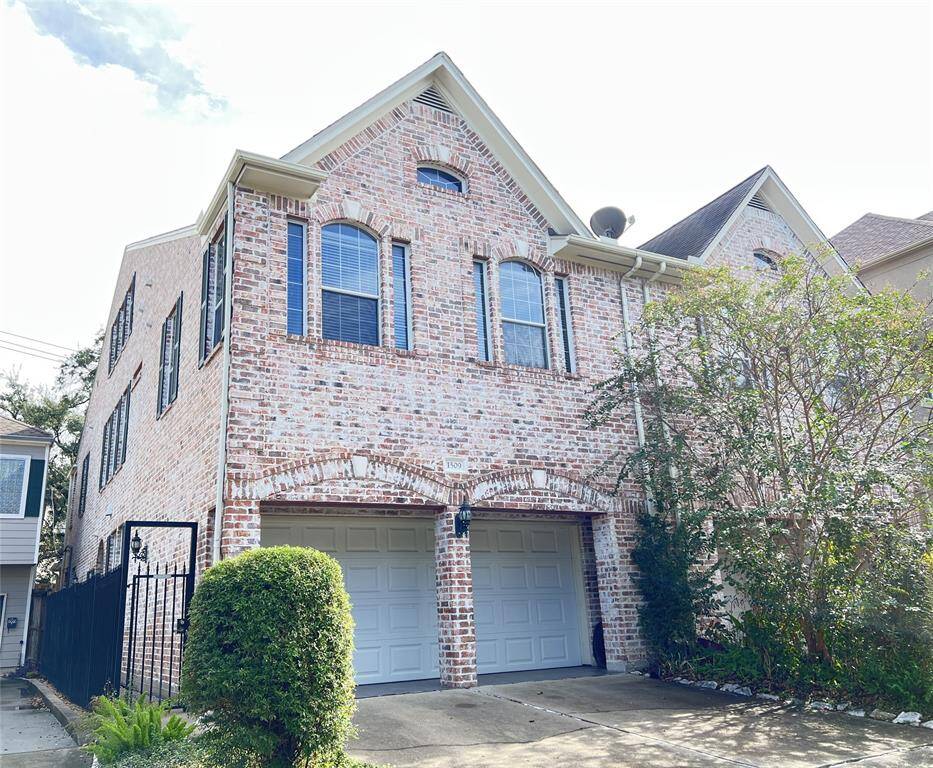 Gated entry to front door, located on the left side of the home.