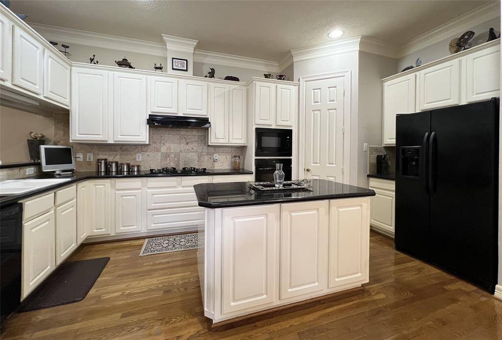Island without cooktop, and walk in pantry.