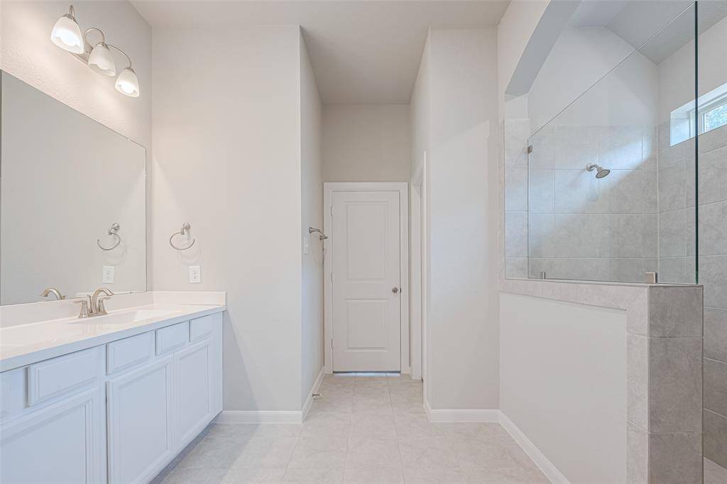 Walk in shower with window.