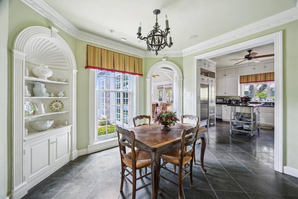 The charming breakfast room approximately 11' x 10' opens to the kitchen and the south-facing windows all for happy natural light.
