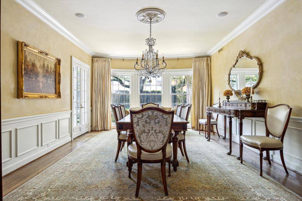 The formal dining room is approximately 20' x 15'.  The walls have been finished in Venetian plaster by Segreto. There are also speakers.  The chandelier and window coverings will remain .