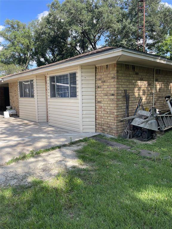 Charming single-story home with brick and siding exterior, featuring large windows and a spacious yard. Ideal for those seeking a cozy, inviting space with ample outdoor potential.