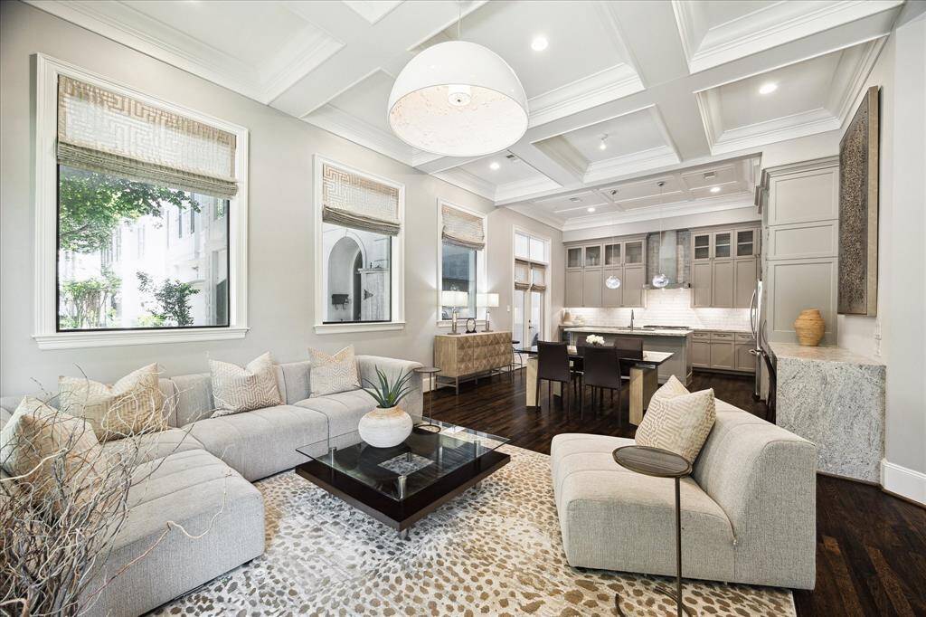 Living space looking toward the dining and kitchen spaces.   Note the beautiful quadrant ceilings.