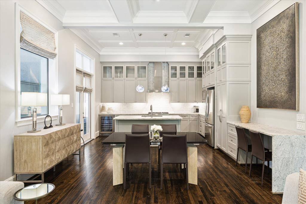 Dining Room.   Art lighting.  Open to Living and Kitchen spaces.