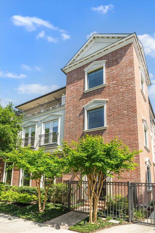 Federal style architecture with pediment framed windows and ornamental gables.