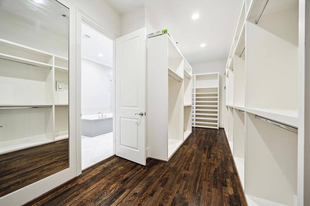 Primary Bedroom Walk-in Closet.  2 entries.   Larger that it appears from this photo!