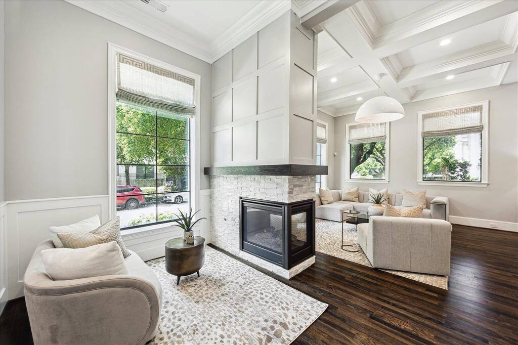 Cozy sitting area, could be uses as home office space.   3 sided Fireplace with gas logs.   Views in to living room.