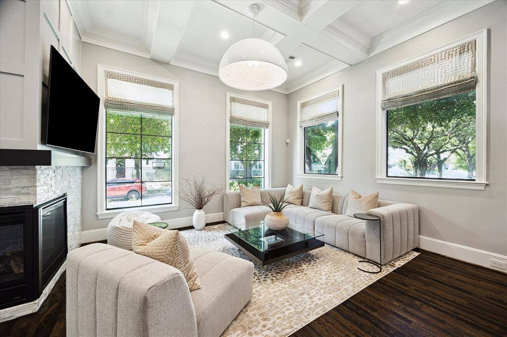 Living Room.  First floor living. Lots of natural light and greenspace views.  Hardwood floors throughout the first floor.