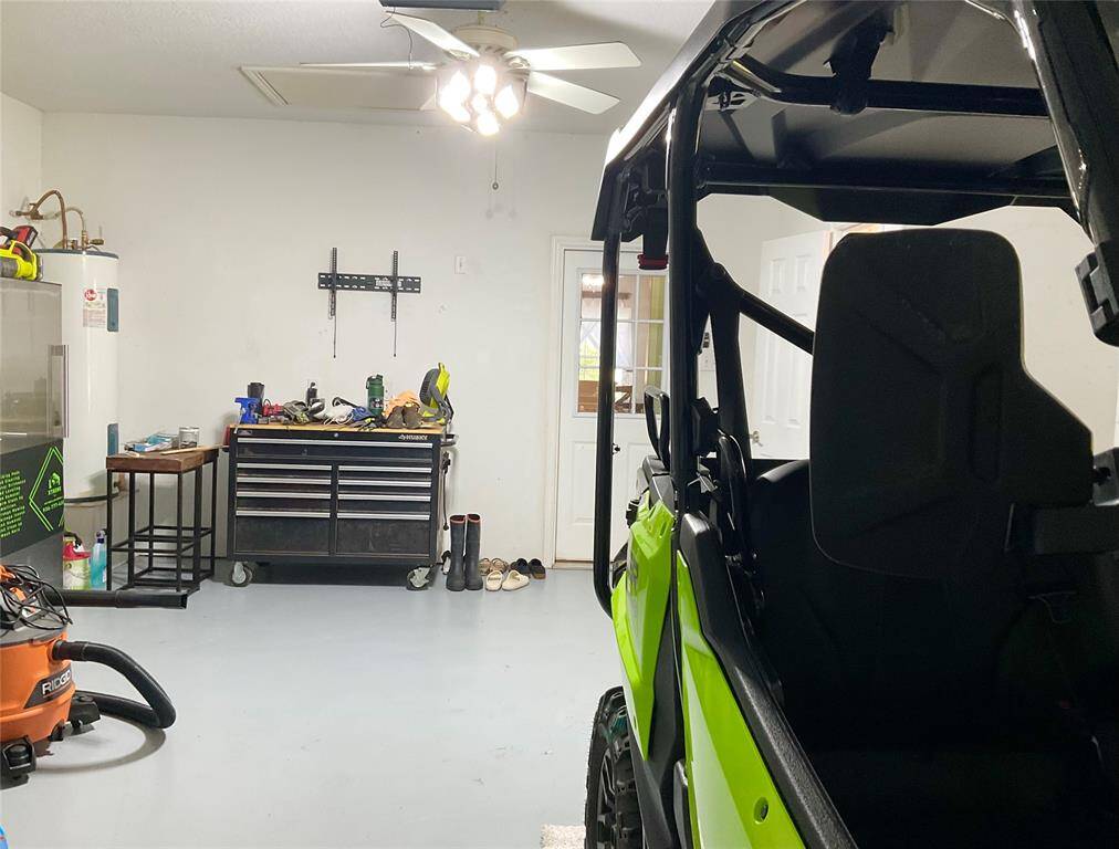 Wish you had a "Hide out'?  Clean and ready for the next project with hits very own half bath!!  I love the fact the hot water heater is in the garage!  This is an ideal Garage Hide Out with a TV wall mount and fresh epoxy flooring paint.  What a great HANG OUT as you organize your play toys!