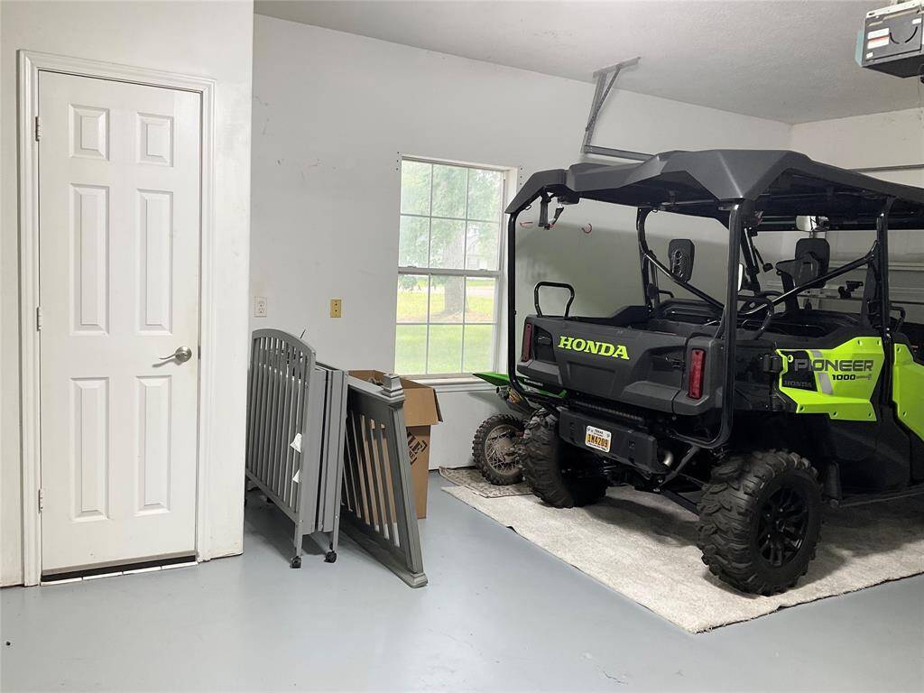 Wish you had a "Hide out'?  Clean and ready for the next project with hits very own half bath!!  I love the fact the hot water heater is in the garage!  It's time for toys and there is a mount for a large screed TV ready to go!