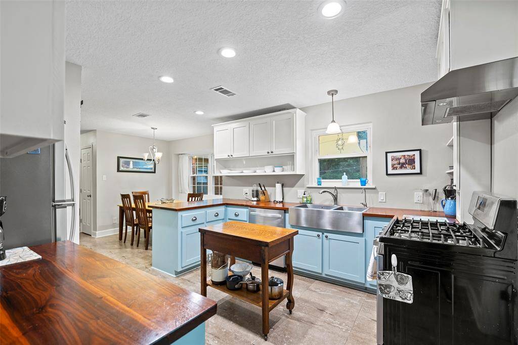 Unique butcher block countertops and double compartment country stainless sink!