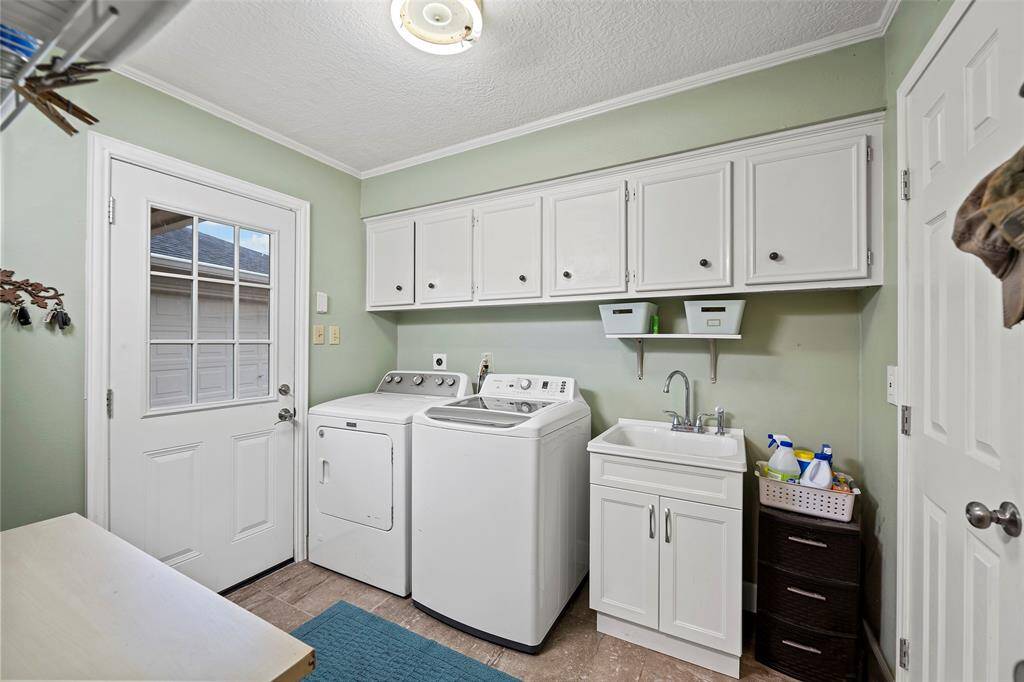 The laundry room is oversized with sink.