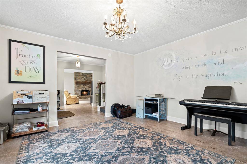 Being so close to the kitchen, this formal could also be used as an oversized formal dining room.