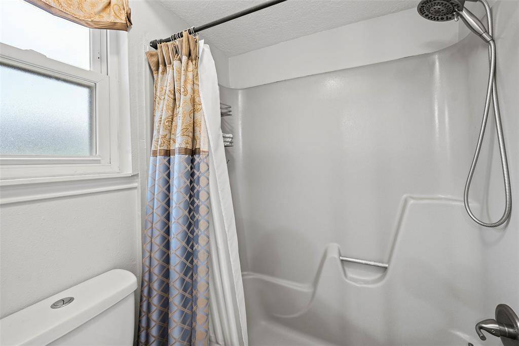 Separate toilet/bath area in the secondary bathroom.