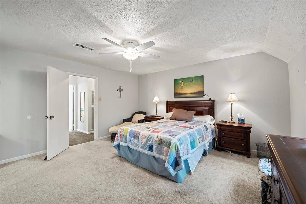 The primary suite is also at the top of the stairs.