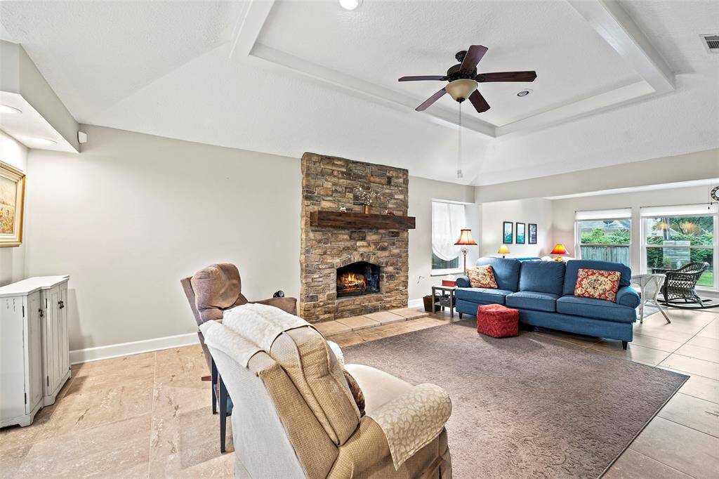 This oversized tile is recent and room flows right into the sunroom.