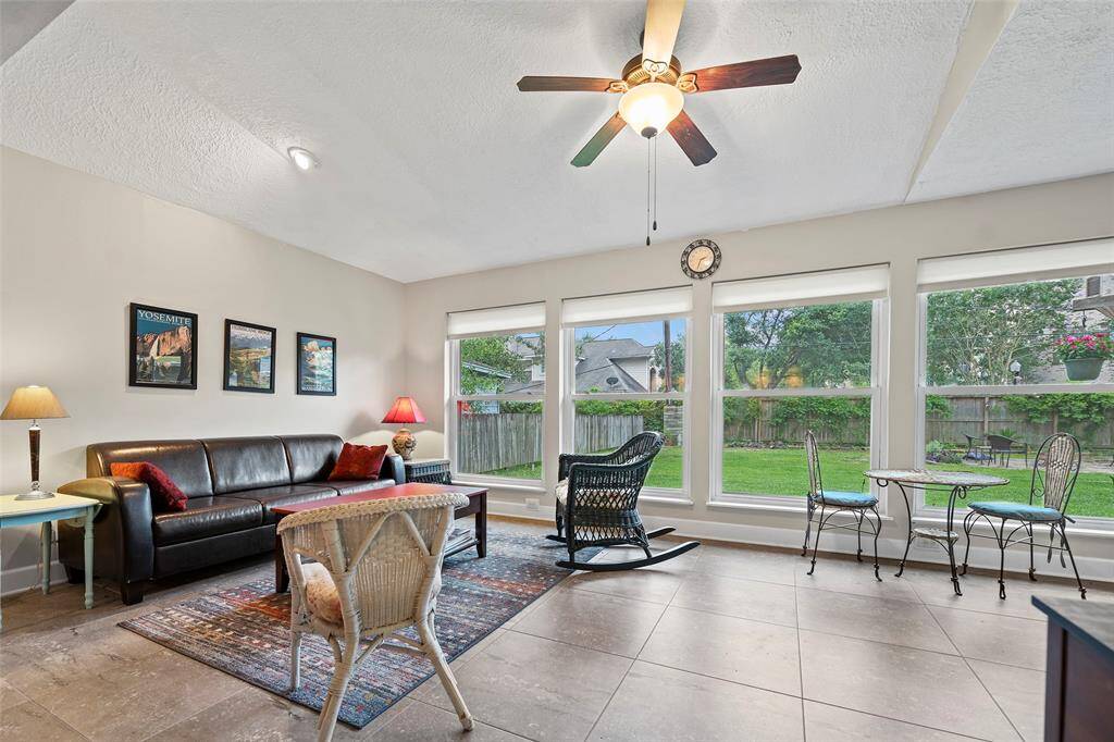 The sun room includes this wall of windows and plenty of space.