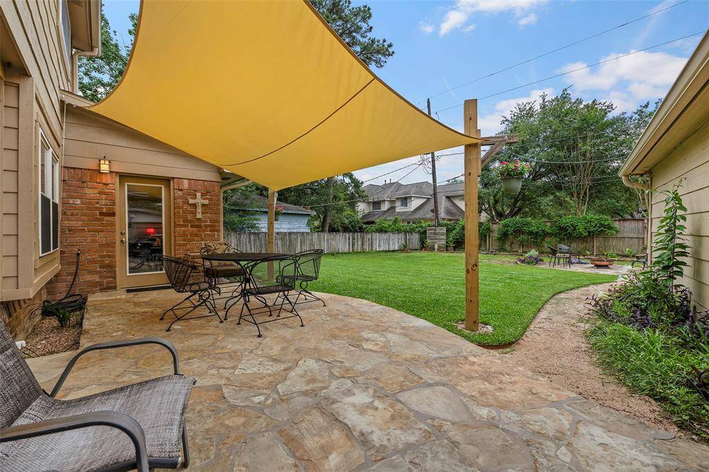 The flagstone patio overlooks a HUGE backyard!