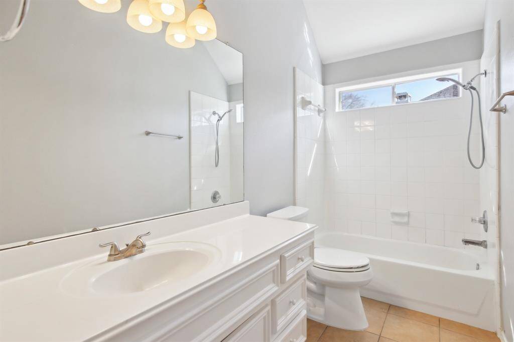 Upstairs full bathroom with a combo shower/tub.