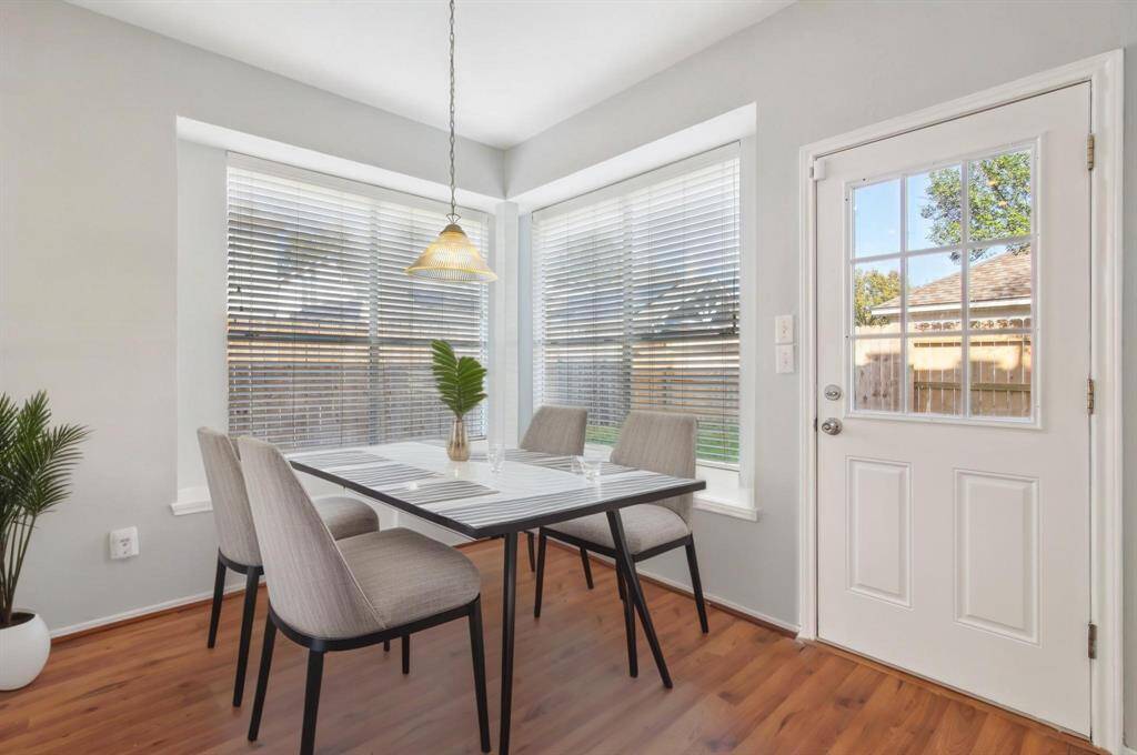 Breakfast nook connected to the kitchen. [virtually staged]