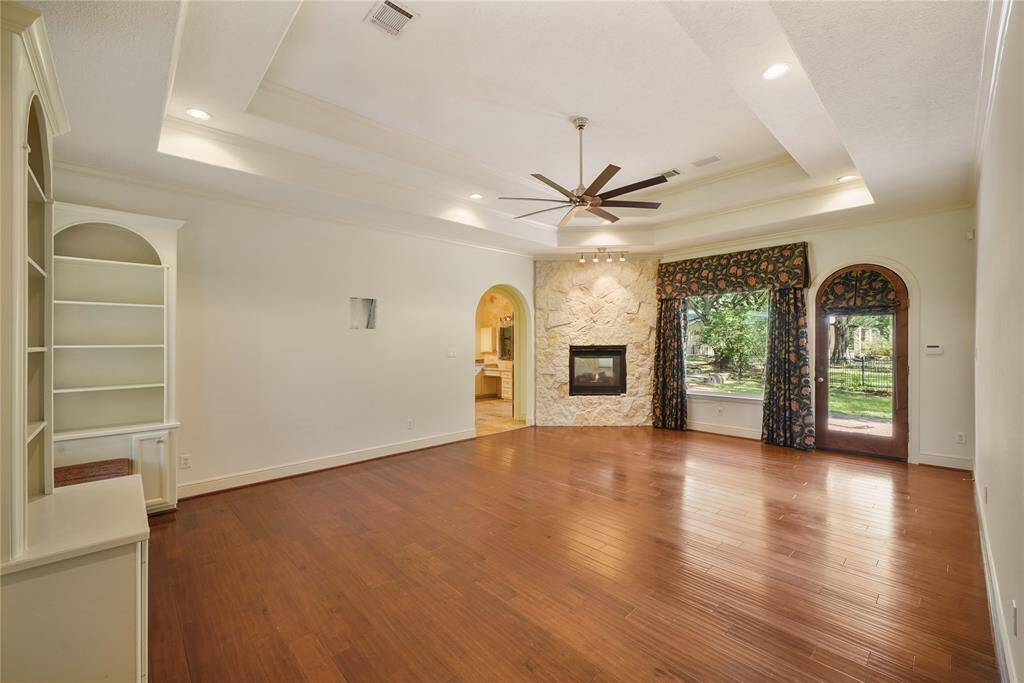 Luxurious primary retreat with a captivating see-through fireplace that seamlessly connects the serene bedroom, sitting area and spa-inspired bathroom - a true sanctuary of comfort and elegance