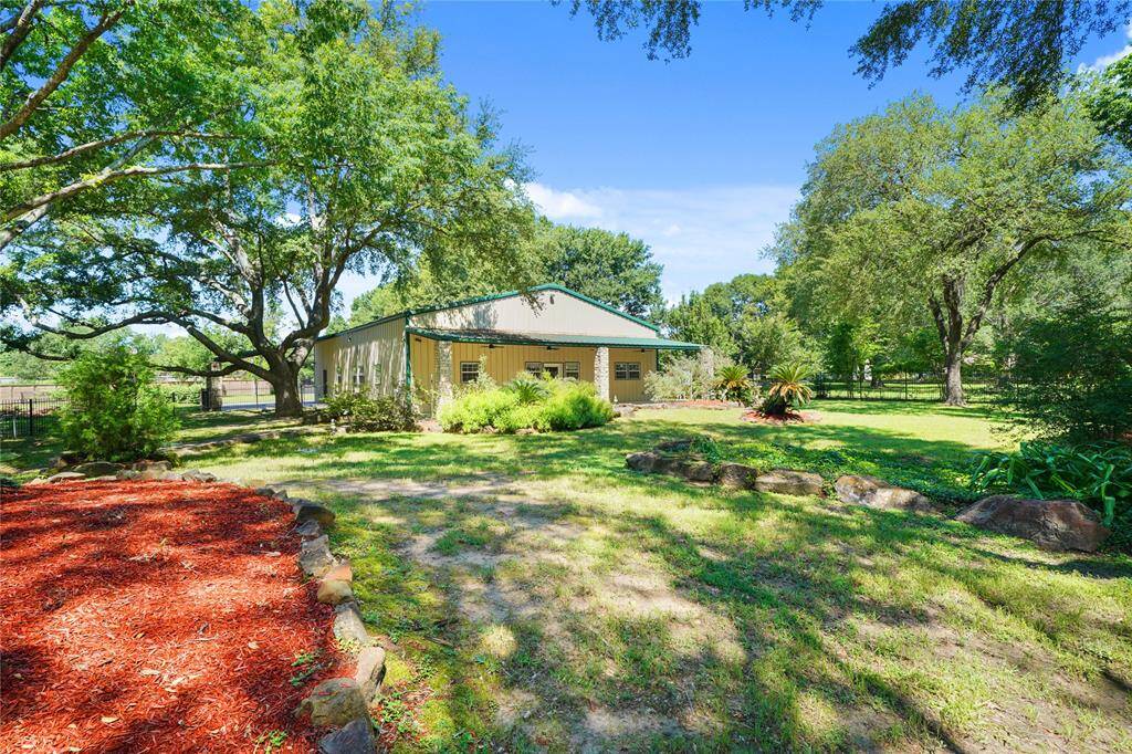 Expansive barn featuring a fully equipped 1,800 sq ft guest house with 2 bedrooms and 2 bathrooms and a separate warehouse/storage area that is ample in space