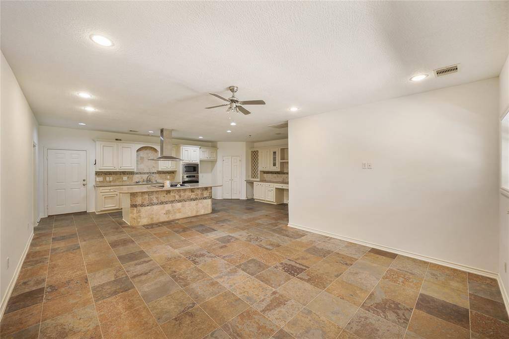 Stylish guest house, featuring an open-concept kitchen with a huge island - designed for comfort and convenience.  This is the perfect retreat for visitors - it has a separate gate, entrance, and carport off of Barker Cypress.