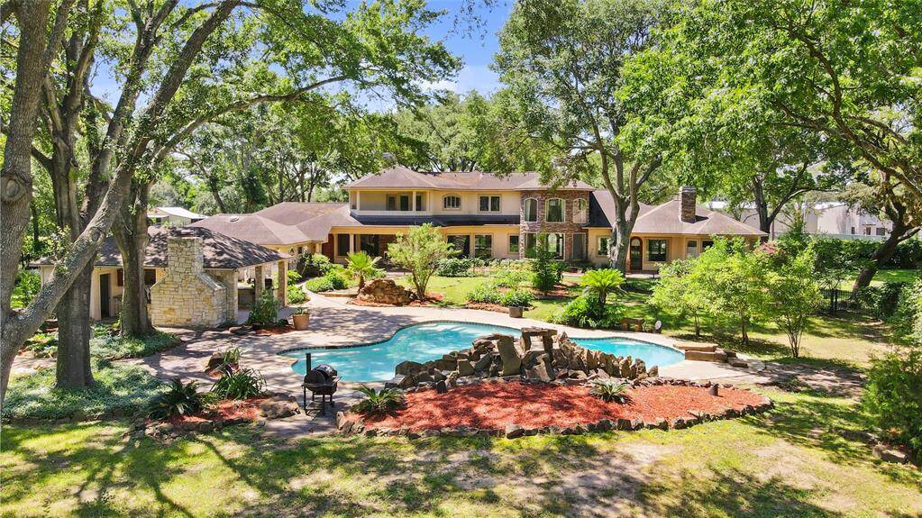 Breathtaking backyard elevation that is even more impressive in person - a must see to fully appreciate the beauty and grandeur of this private outdoor oasis