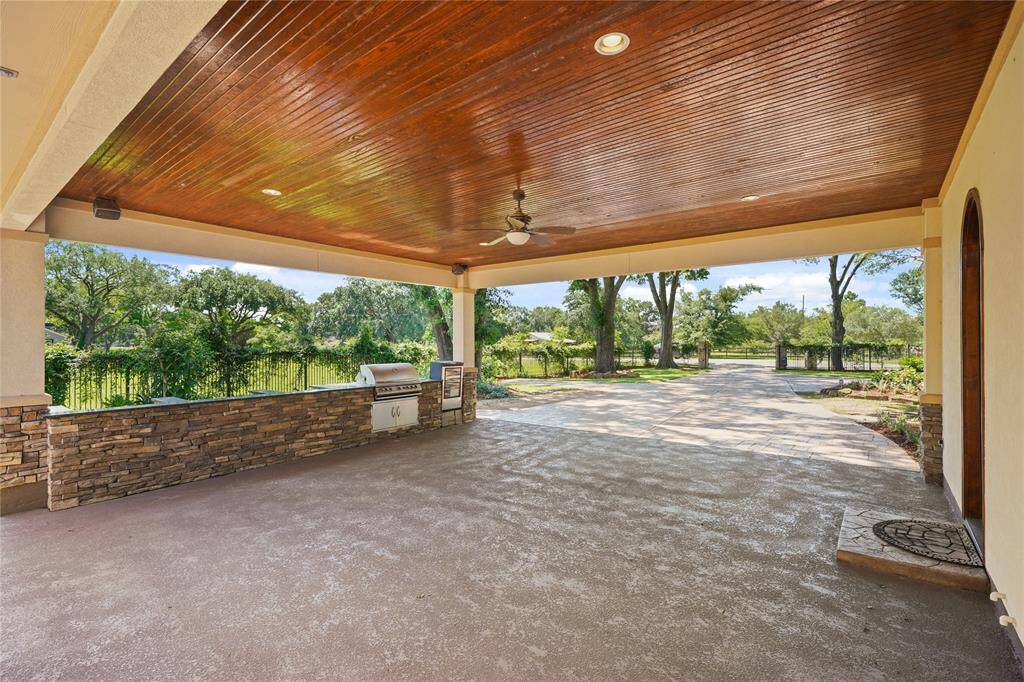 Elegant porte-cochere offers a grand, covered entry with convenient drive-up access