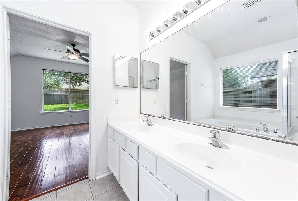 Primary bath with double sinks for added convenience and space.