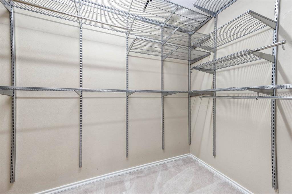 Walk-in primary closet with plenty of space for all your essentials!